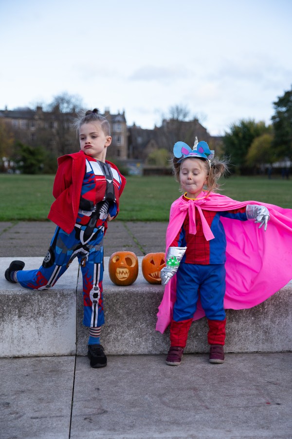 children in halloween costumes and silly poses